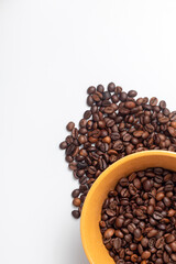 Yellow breakfast bowl filled with coffee beans