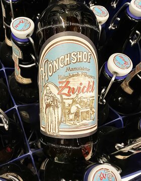 Viersen, Germany - Juin 9. 2024: Bottle bavarian unfiltered Zwickel beer in crate, vintage label with monk abbey motif