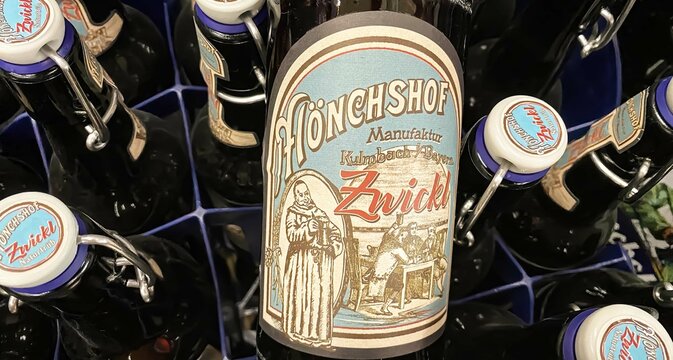 Viersen, Germany - Juin 9. 2024: Bottle bavarian unfiltered Zwickel beer in crate, vintage label with monk abbey motif