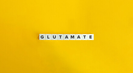 Glutamate Word. Amino Acid and Neurotransmitter. Text on Block Letter Tiles on Yellow Background. Minimalist Aesthetics.