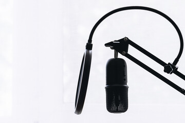 Proffesional studio microphone on white background close up.