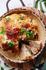 Whole baked cauliflower with minced meat and sauce..selective focus