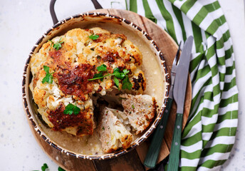 Whole baked cauliflower with minced meat and sauce..selective focus