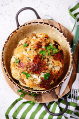 Whole baked cauliflower with minced meat and sauce..selective focus