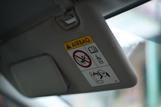 Airbag warning under car visor 