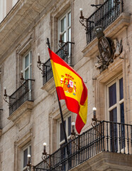 Spanish flag waving on a balcony in Madrid