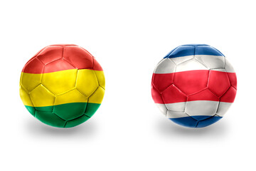 Fototapeta premium football balls with national flags of bolivia and costa rica ,soccer teams. on the white background.