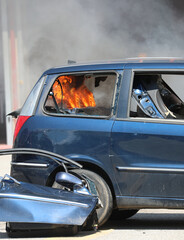 fire inside  the car after the riot of the rioters in the city