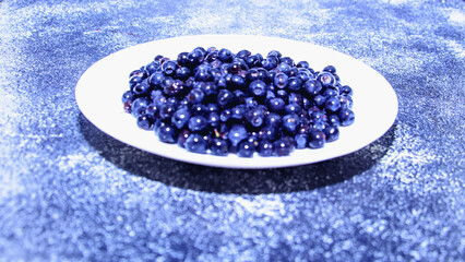 Fresh tasty aromatic blueberries on a beautiful background