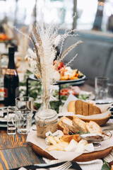 Wedding table with various appetizers and decorations