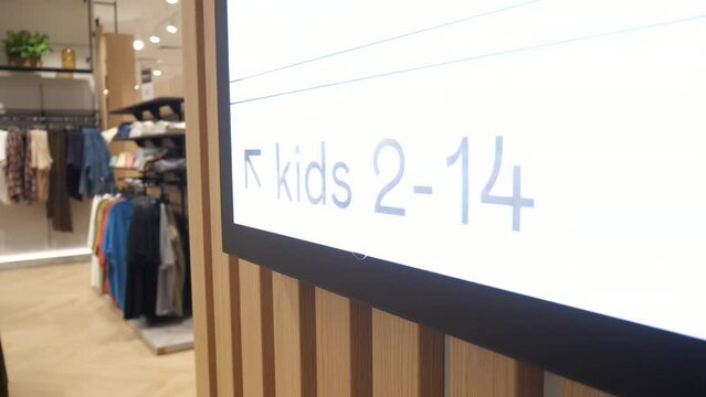A sign in a store indicating the ages of children from 2 to 14 years old.