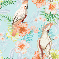 Tropical vintage palm leaves, pink hibiscus flower, pink cockatoo parrot floral seamless pattern blue background. Exotic jungle wallpaper. © good_mood
