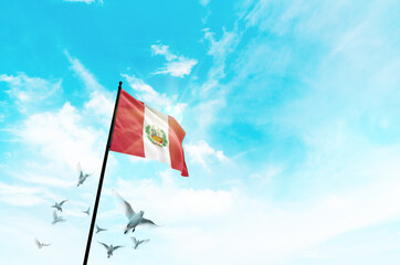 Peru flag waving with flying doves against sunset or sunrise. Peru flag for Republic Day and Independence Day.