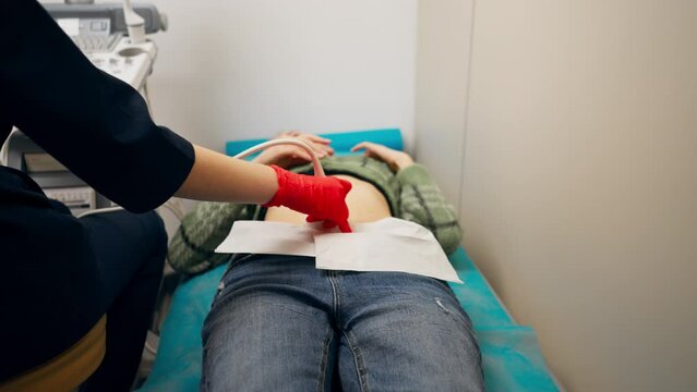 In a gynecological office in a clinic doctor conducts an ultrasound of a patient s small organs