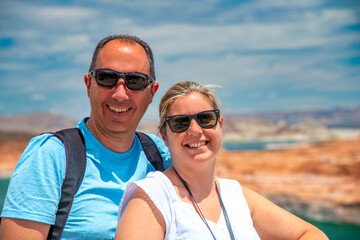 A happy couple visiting Glen Canyon Dam Bridge