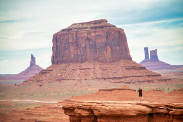 Amazing view of Monument Valley Buttes in Arizona, a man and the landscape