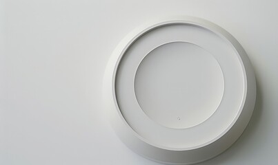 Minimalist Art: Abstract Sculpture with Circles and Curves in Gray Tones on White Wall