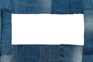 Hole in denim on a white background. Ripped jeans