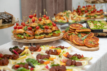 Catering buffet with variety of food snacks and appetizers.