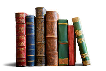 Some antique books in shades of red, blue, brown, and green, standing with their spines facing forward and isolated on an empty background
