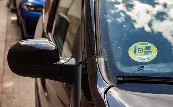 Low Emission Zone B badge on car in Madrid, part of the environmental sustainability plan Madrid360