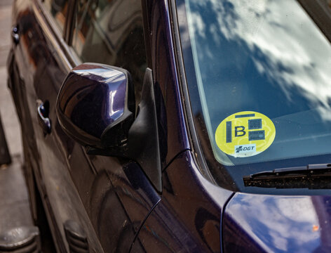 Low Emission Zone B badge on car in Madrid, part of the environmental sustainability plan Madrid360