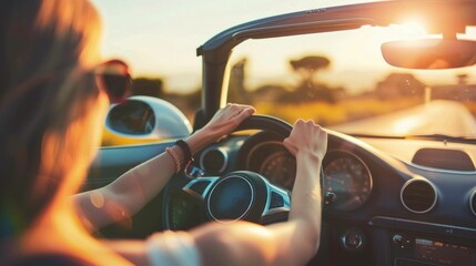 Woman enjoying a luxurious travel experience in a convertible car with the glowing sun in the background