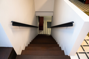 Stairs going up in a beautifully designed hotel, black stairs