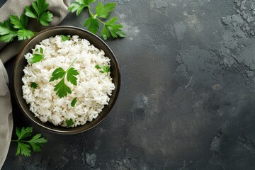 Bowl of delicious rice on table  top view with space for text