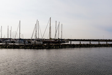 Fototapeta premium Sea pier with boats and yachts at sunset. Bornholm, Denmark