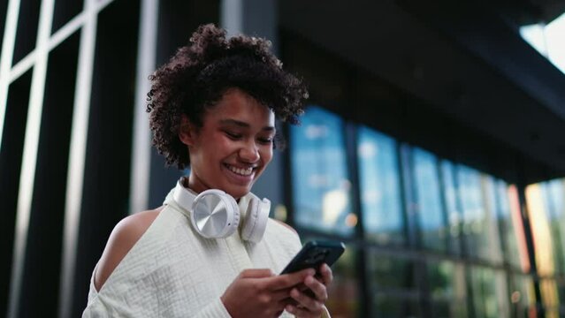Smiling woman using smartphone for online shopping. digital retail platforms to browse, select, and purchase products through mobile technology, combining convenience with modern technology
