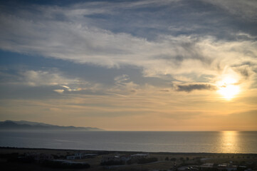 sunrise over the sea with blue water and blue sky
