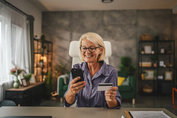 Mature woman work from home buy online on cellphone use credit card