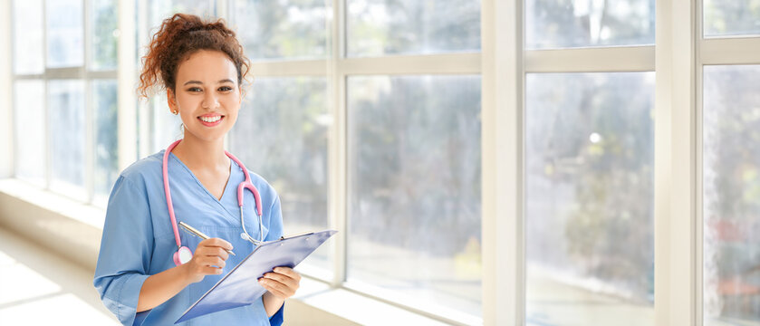Young African-American nurse in clinic