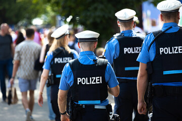 german police officer patroling outdoors background