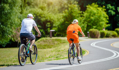 Cyclists ride on the bike path in the city Park
