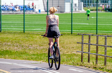 Fototapeta premium Cyclist ride on the bike path in the city Park 