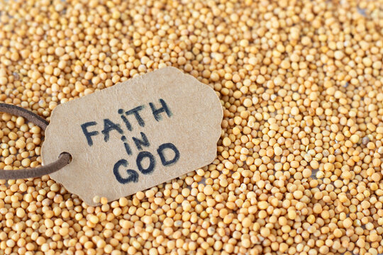 Faith in God, handwritten quote on rustic paper note on top of mustard seeds. Christian parable, trust and belief in Jesus Christ, biblical concept.