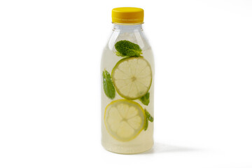 Summer refreshing drink lemonade with lemons,Mint leaves,Lime in a bottle