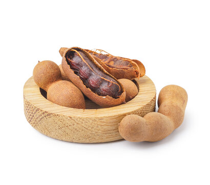 Bowl of tasty tamarinds on white background