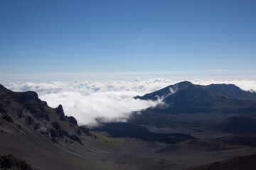 Majestic Mountain Landscape with Rolling Clouds and Clear Blue Sky