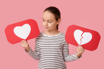 Little girl with heart like and dislike icons on pink background
