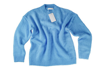 Fototapeta premium Blue flying crumpled women autumn knitted sweater with blank label tag isolated on white, transparent background. Creative clothing concept, cozy creasy jersey pullover. Fashion template, mockup