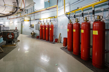 Automatic industrial fire extinguishing system. CO2 fire extinguishers connected with pipeline
