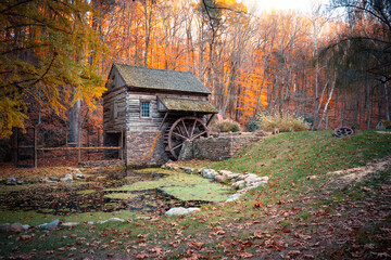 Beautiful autumn scene at Cuttalossa barn mill in Bucks County Pennsylvania with colorful fall foliage. 