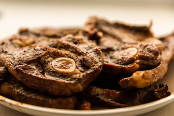 close up of lamb chops with bone marrow on a plate