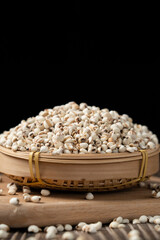 closed up of Job's tears on wooden table.