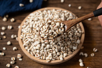closed up of Job's tears on wooden table.