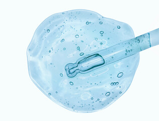 Pipette with liquid setum or lab medicaments blue white background isolated