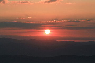 Beautiful sunrise over the mountains with mist, sky and cloud. Fresh and relax type nature landscape.  Dramatic outdoor scene